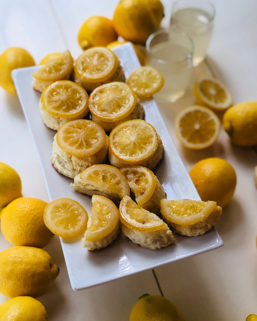Candied lemon scones on a white platter